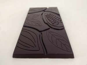 Photo of a dark chocolate bar with a cocoa pod design