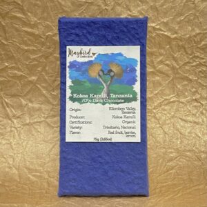Kokoa Kamili Chocolate bar in wrapper with gold background