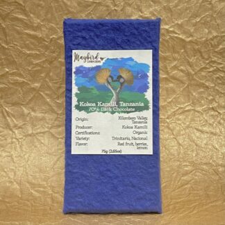 Kokoa Kamili Chocolate bar in wrapper with gold background