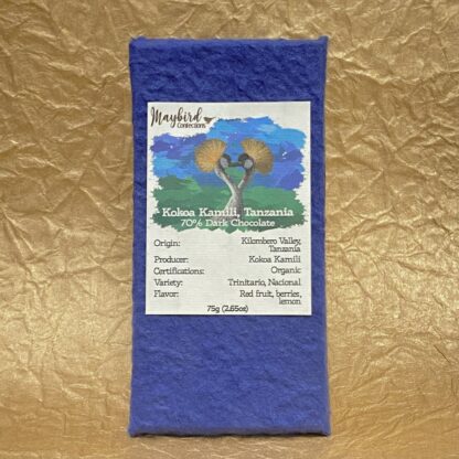 Kokoa Kamili Chocolate bar in wrapper with gold background